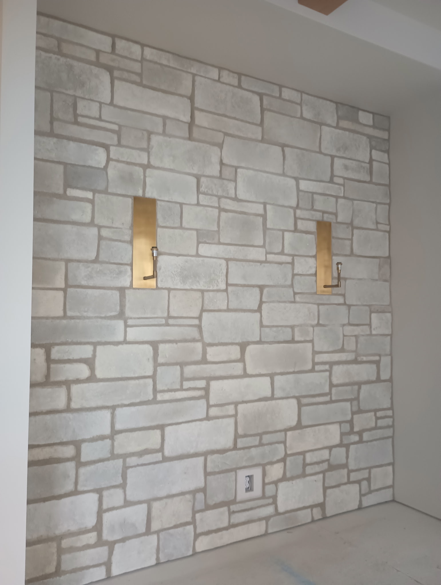 Stone Accent Wall with Sconces